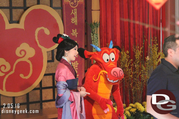 Mulan and Mushu were greeting guests.