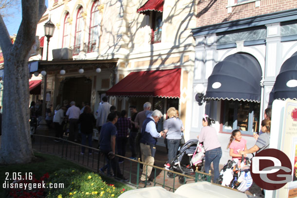 A line of guests to register for a screening time.  You could also get a button here.