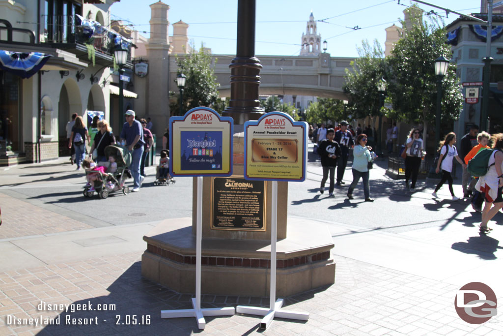 Signs advertising the AP Days near the dedication plaque.