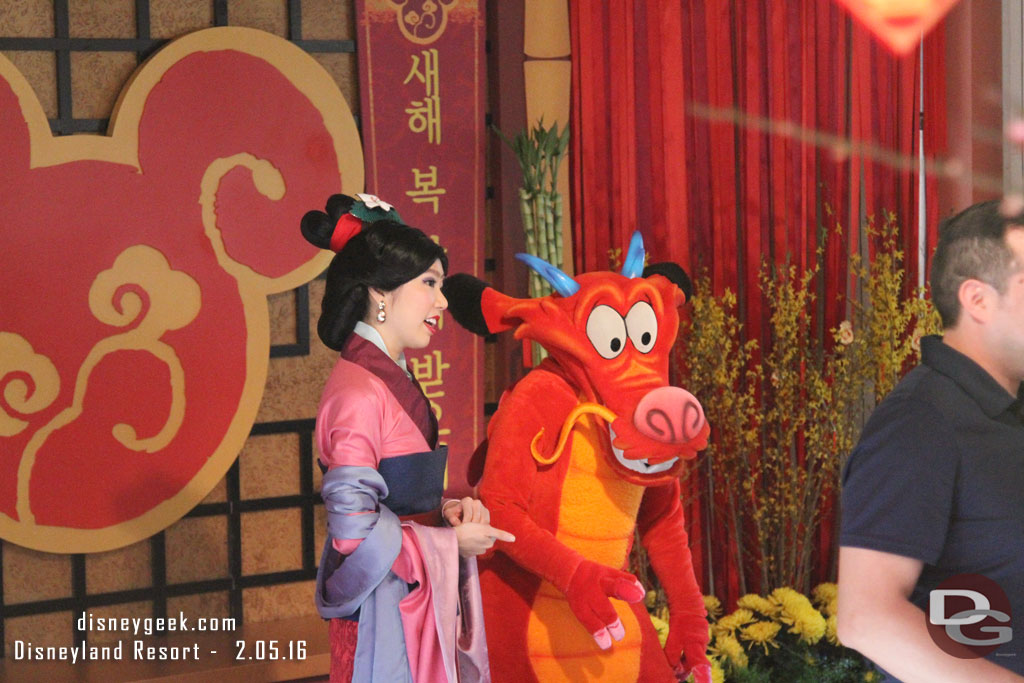 Mulan and Mushu were greeting guests.