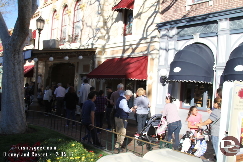 A line of guests to register for a screening time.  You could also get a button here.