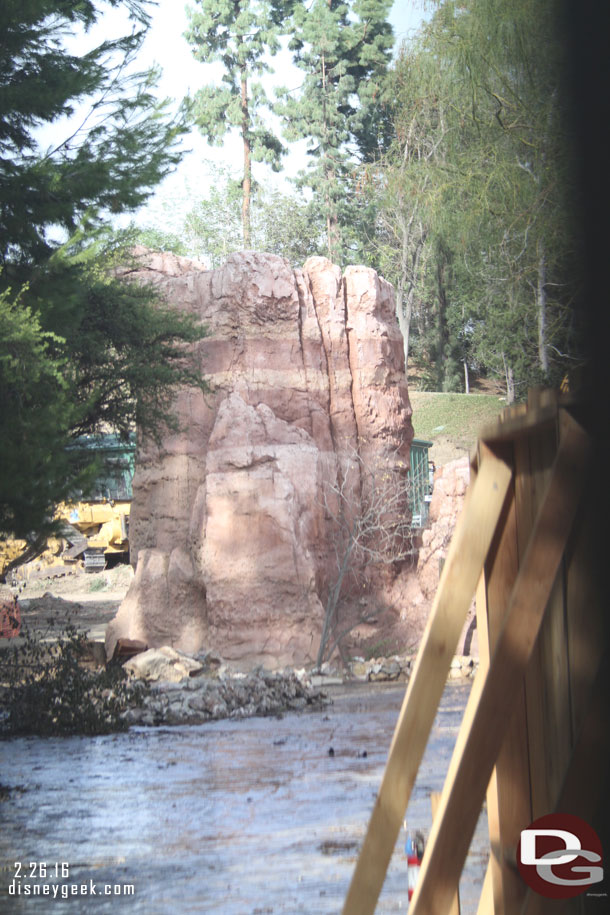 Looking through a hole in the fence you can get a glimpse of what is left of the rockwork.