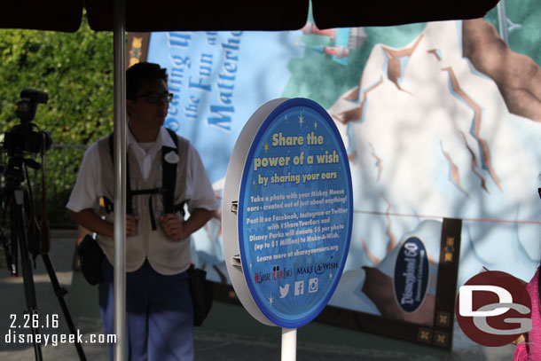 Signs up at the PhotoPass locations for the Share Your Ears promotion.