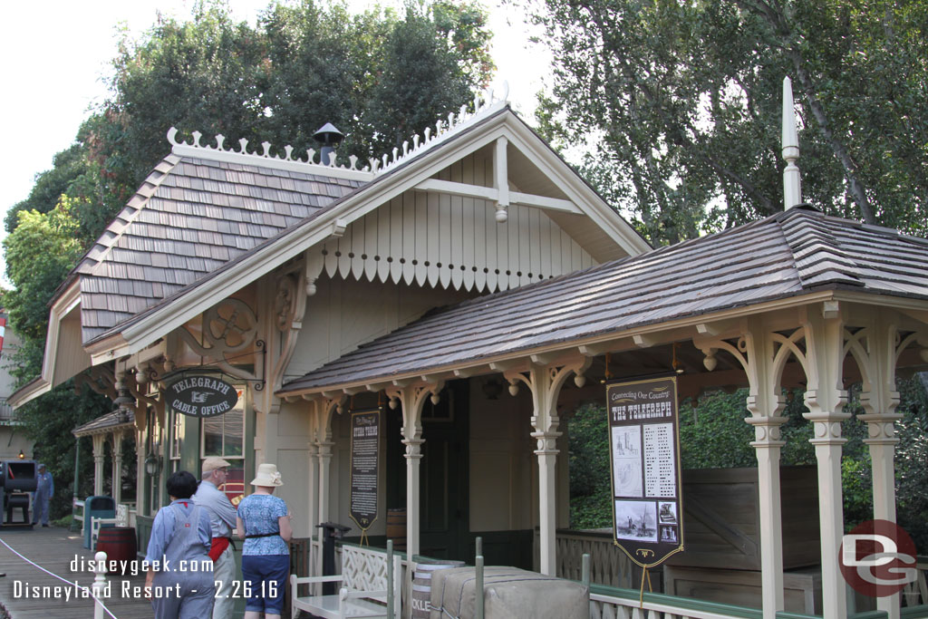 Informational signs up around the station.  The signs are printed on both sides and cast members said the plan is to move the crates out and open that area for guests too.