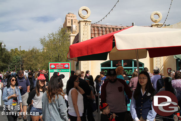 The line was long.  The mass of guests filled the area in front of the attraction and went down Cross Street.