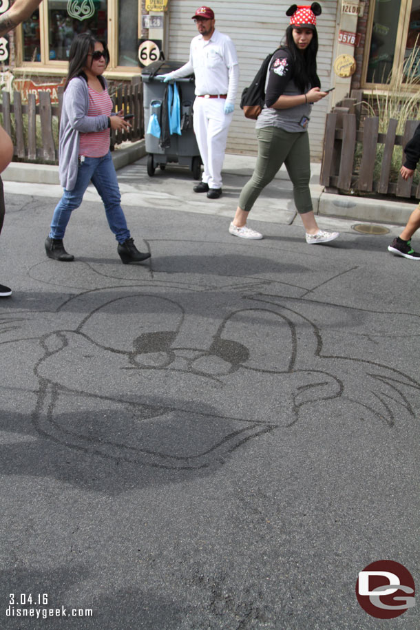 A custodial cast member drew Scrooge McDuck as we waited.