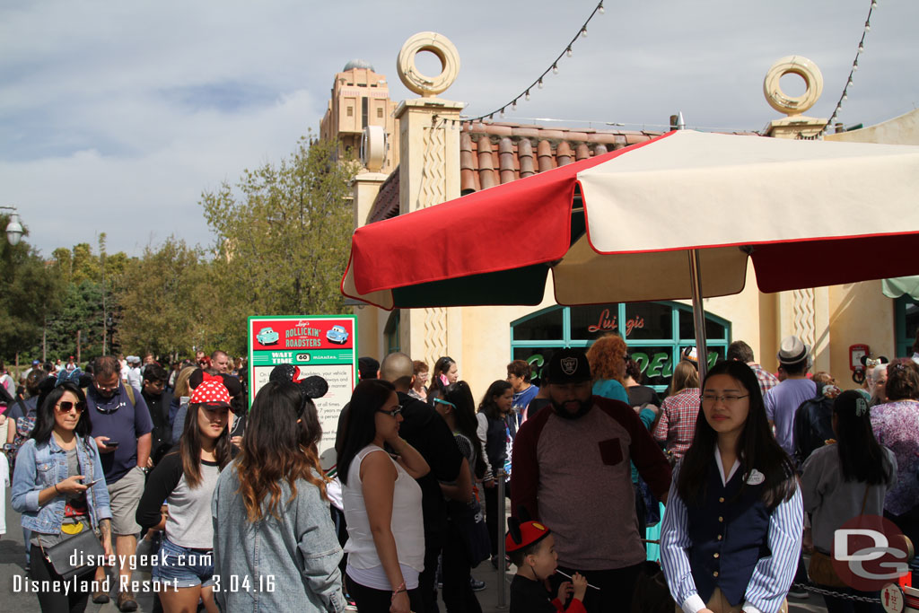 The line was long.  The mass of guests filled the area in front of the attraction and went down Cross Street.