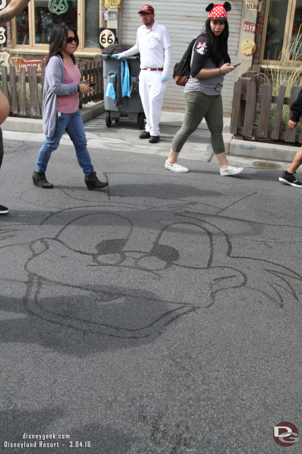 A custodial cast member drew Scrooge McDuck as we waited.