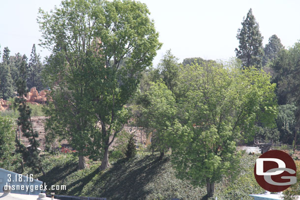 Panning left more trees are gone and you can clearly see into the park and the cabin that sits along the river.