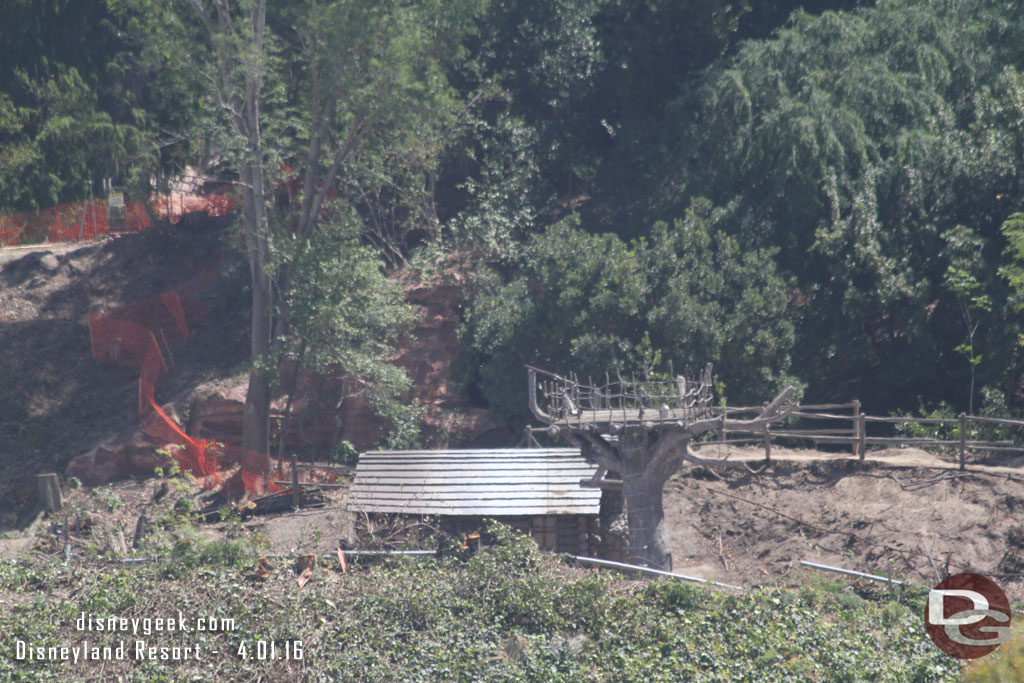 The old cabin and tree house is still along the former banks of the Rivers of America.  The land around it is being cleared.