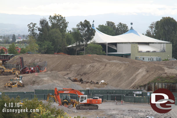 In the foreground the buildings that were removed this past week.  The green fences mark a road connecting the two parts of backstage right now.