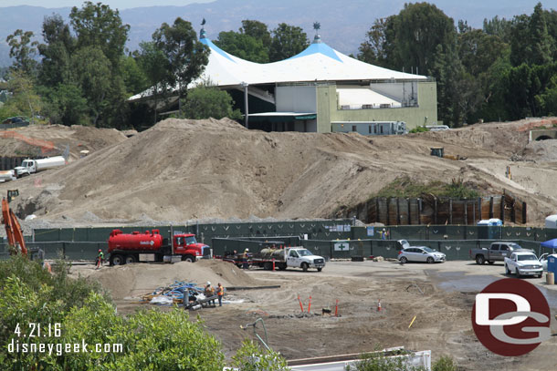 In the foreground work continues on removal of the backstage support facilities.  