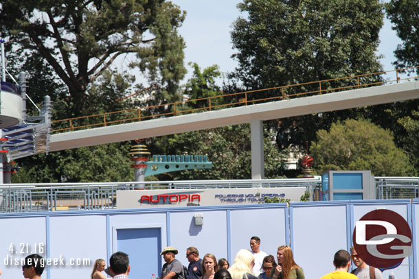 A new finish line sign at the Autopia is visible over the wall.