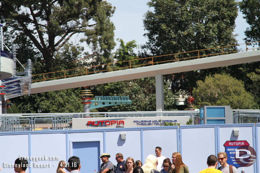 A new finish line sign at the Autopia is visible over the wall.