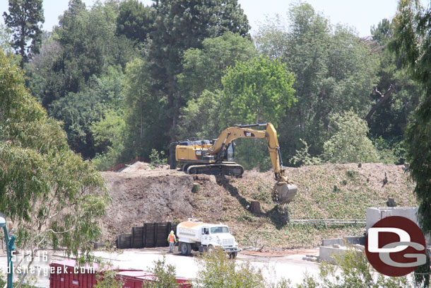 Working on clearing the plants and other debris from the berm.