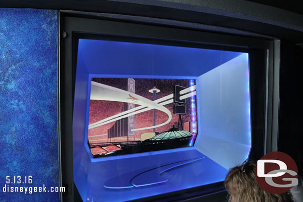 The tunnel area has screens showing old Disneyland TV show clips.