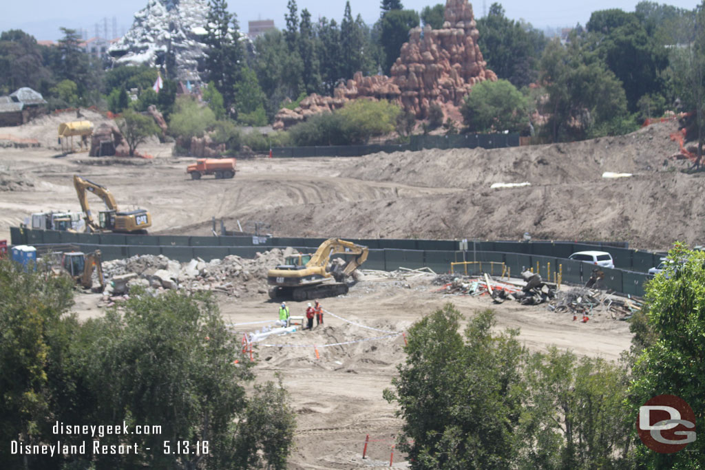 In the foreground they are sorting out debris from the demo work and not sure what they crew in the middle of the picture is doing.