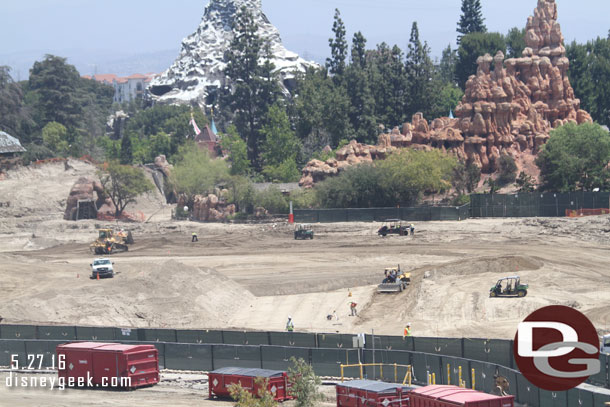 What appears to be a path with dirt built up on both sides is taking shape in the middle of the site.  Maybe it is one of the entrances where the train will pass overhead.