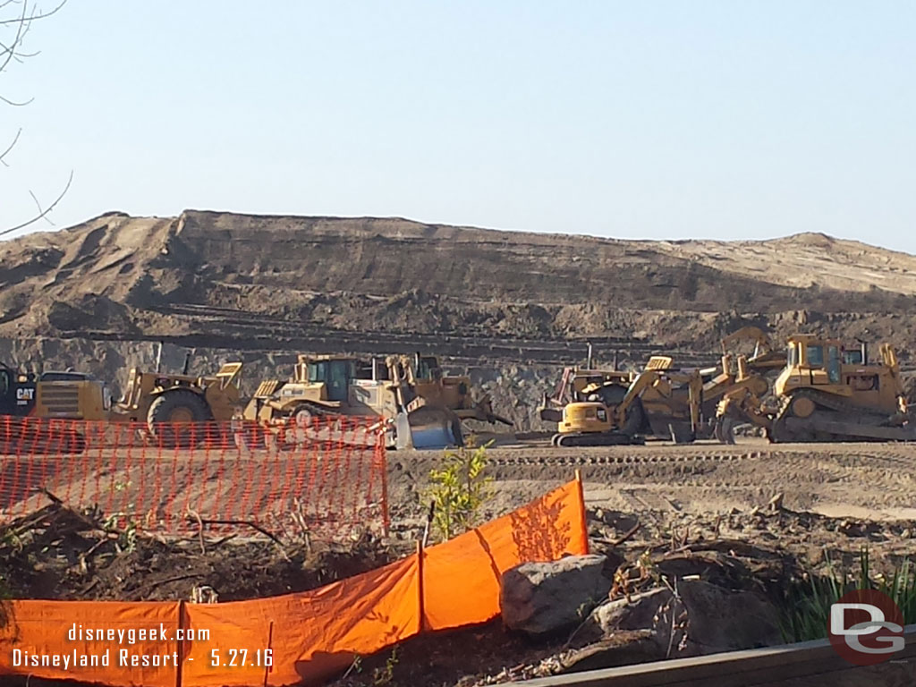 This gives a good sense of scale on the mound of dirt.  Look at the construction equipment in the foreground how the mound towers over it.