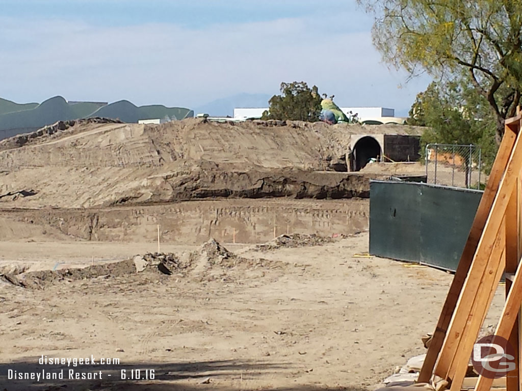 Panning right to left across the site.  Here you can see how they have dug down.  Wonder if this is to help accommodate the train and keep its path level and not such a big dip to go beneath like Toontown?  Or if is is just pre-work before it gets built back up.