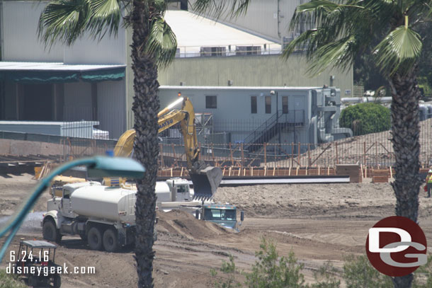 A closer look around the site.  In the distance you can see the foundation for something taking shape.  It may just be a wall to separate the project from backstage  or maybe a retaining wall.  Hard to tell from this distance.