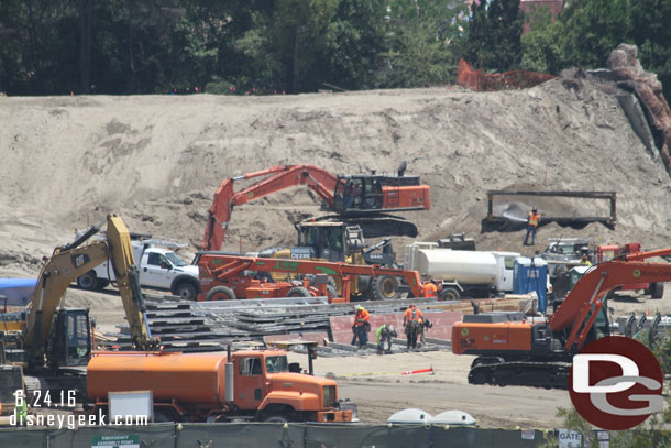 Workers look to be assembling retaining walls or at least panels for something.