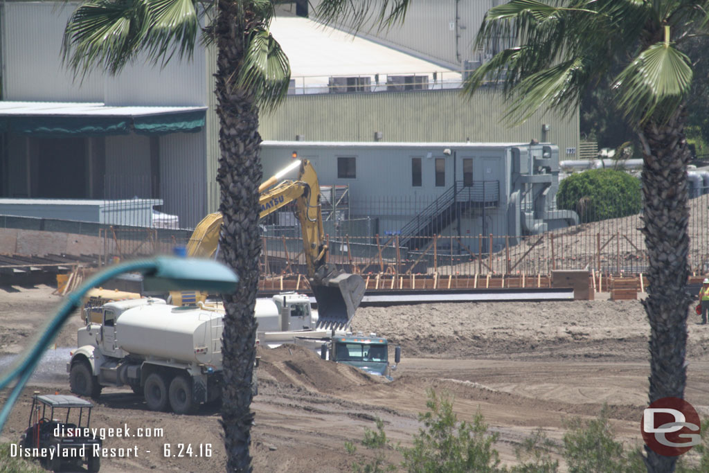 A closer look around the site.  In the distance you can see the foundation for something taking shape.  It may just be a wall to separate the project from backstage  or maybe a retaining wall.  Hard to tell from this distance.