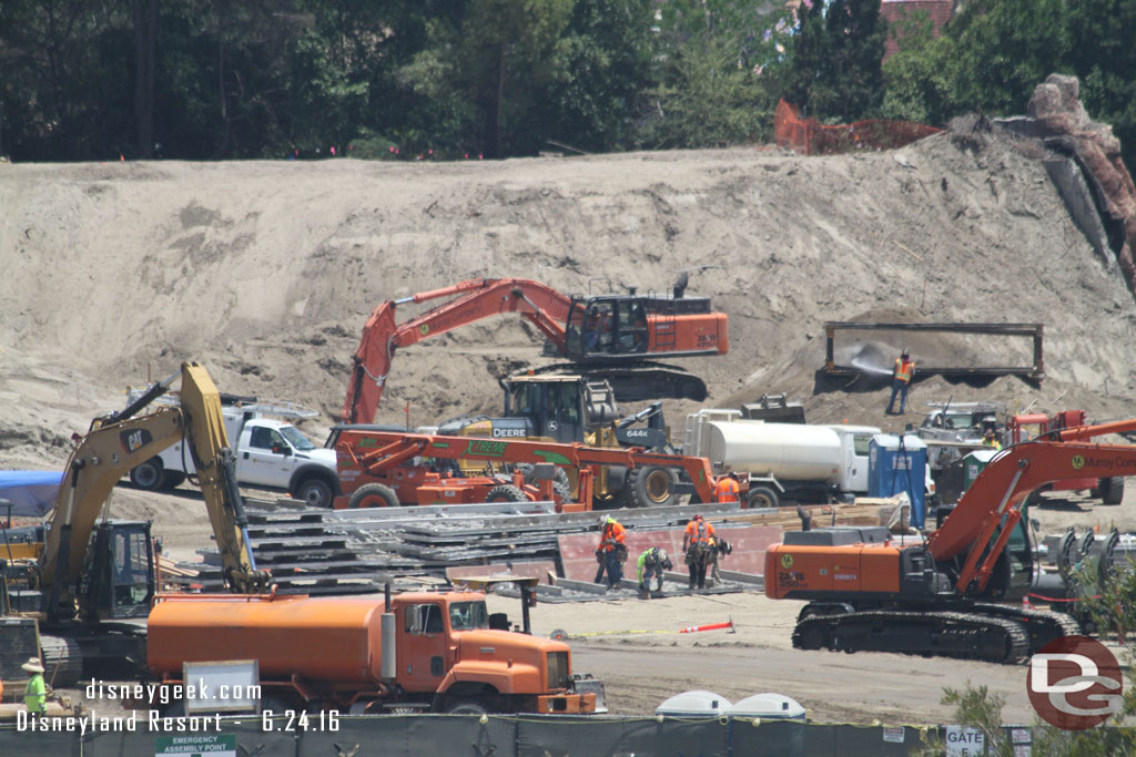 Workers look to be assembling retaining walls or at least panels for something.