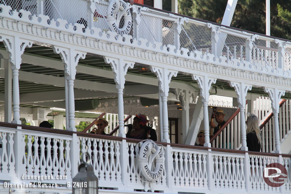 The band and singer performing on the second deck.