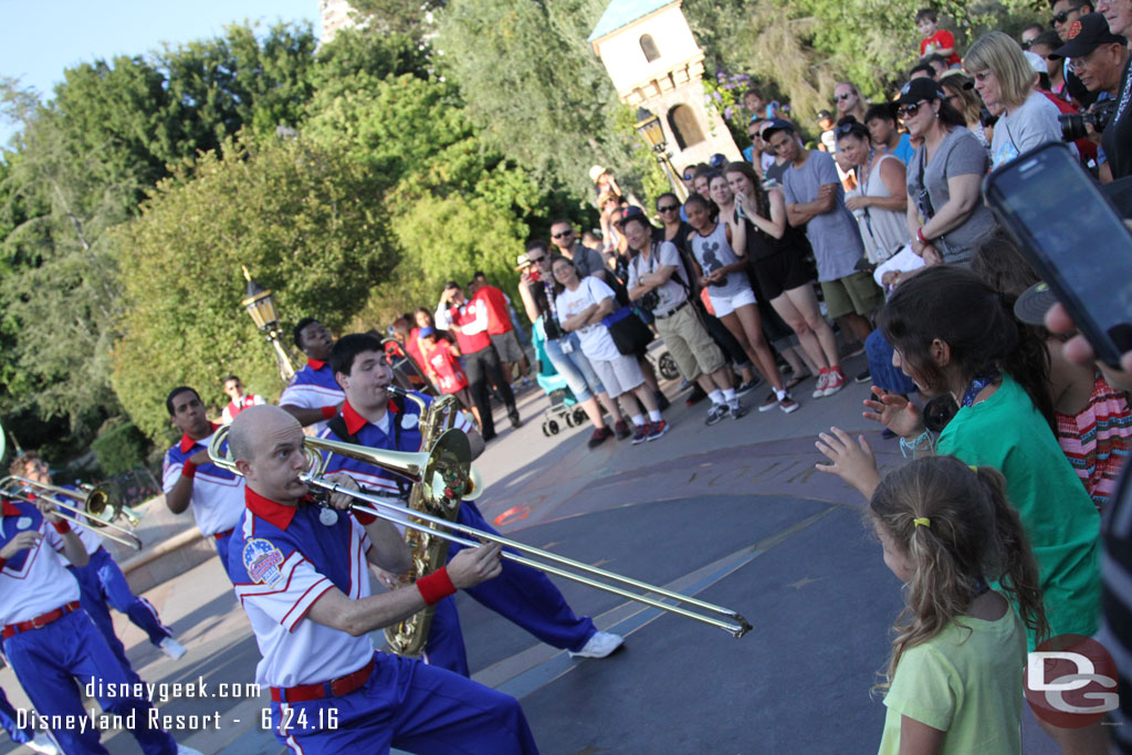 A group of kids were in front and have a great time dancing and singing with the band.