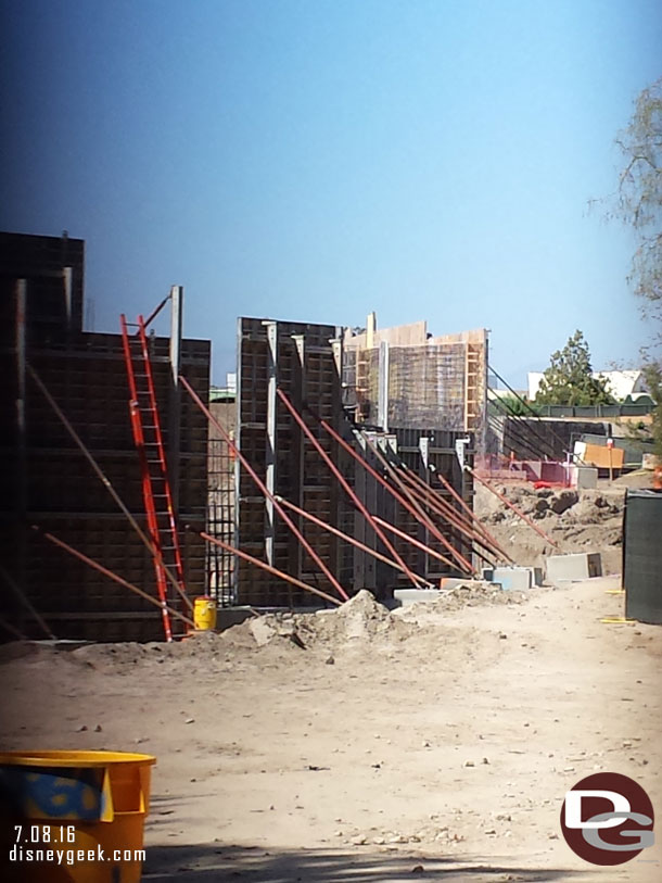 A look through the fence.  You can see the walls going up right along the walkway.  Assuming these will be rockwork along the Big Thunder trail.