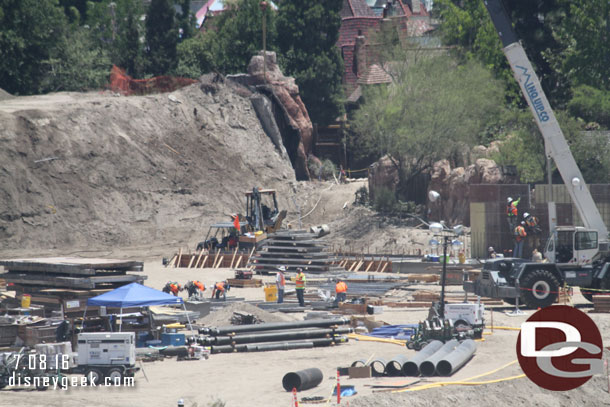 More pipes and conduit waiting to be installed.  In the background more footers being set up to extend the wall.  Guessing it will work its way to connect to the wall by the gate to Fantasyland.