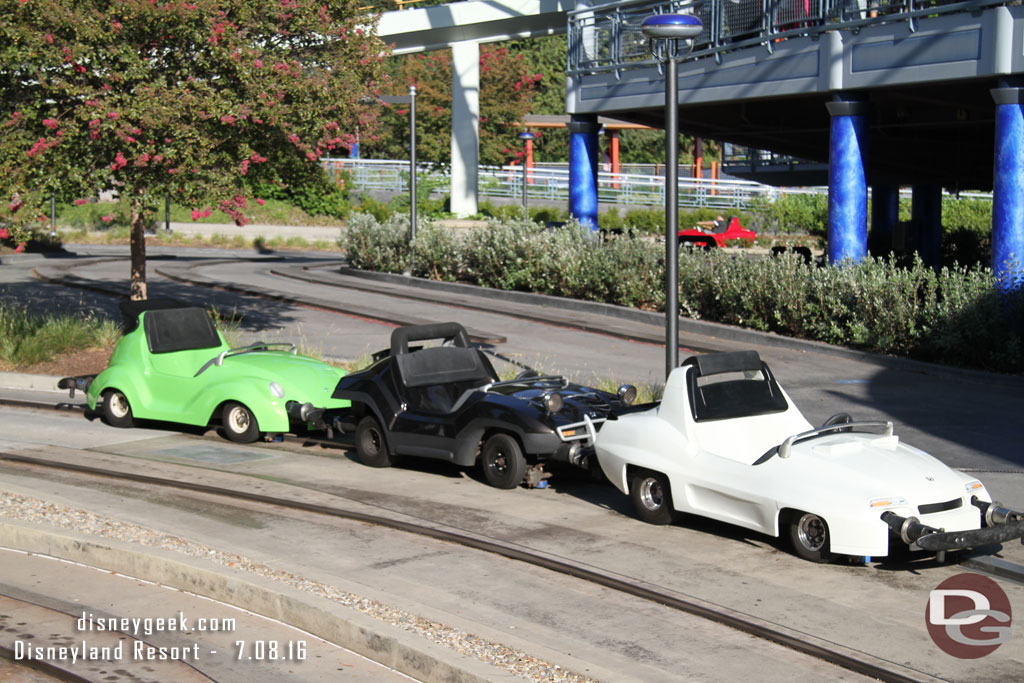 Some cars parked, the green really stands out.