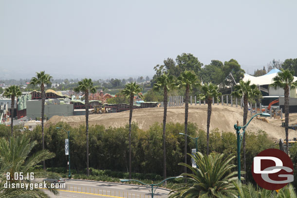 A pan across the site from left to right (north to south).  The large mound of dirt is continuing to shrink as it is used elsewhere on the site.