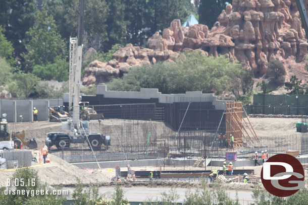 They are moving dirt against the back of the wall along the Big Thunder Trail and the wall is being extended around the corner now.