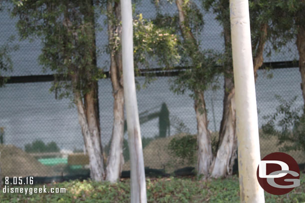 You really cannot see much from ground level here with the trees, fence, and mounds of dirt.