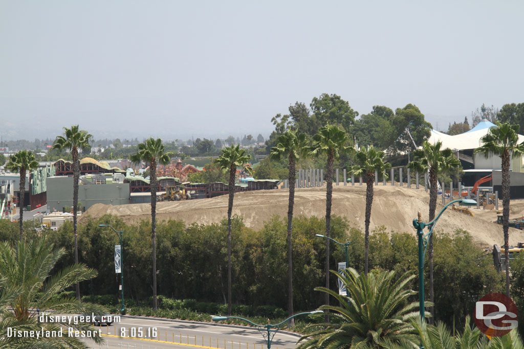 A pan across the site from left to right (north to south).  The large mound of dirt is continuing to shrink as it is used elsewhere on the site.