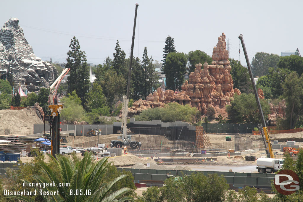 The footers are done for the next section of wall and the rebar is growing.  Also in the background notice the dirt level rising along the Big Thunder Trail wall.