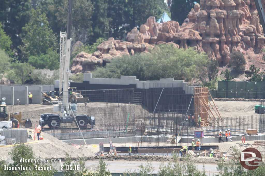 They are moving dirt against the back of the wall along the Big Thunder Trail and the wall is being extended around the corner now.