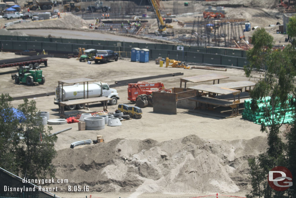 In the near area dirt and equipment as work continues on the utility installation under the new perimeter road.