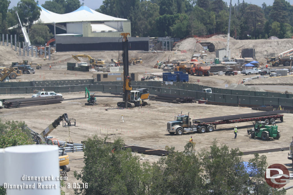 Is this possible the start of work on the foundation for one of the show buildings?  It appeared they were driving steel beams into the ground, maybe to be used as retaining walls to dig a basement.  Just guessing at this point.