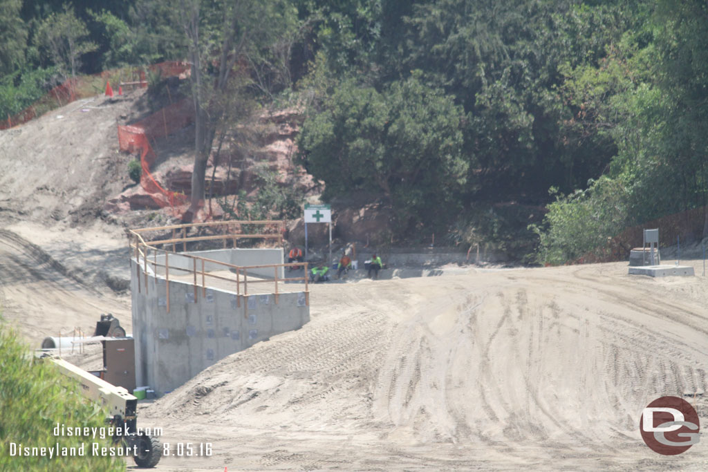 A closer look at how they filled in the tip of the island.  They dirt level has been brought up over the conduit/pipe boxes on the right and up toward the top of the retaining wall on the left.