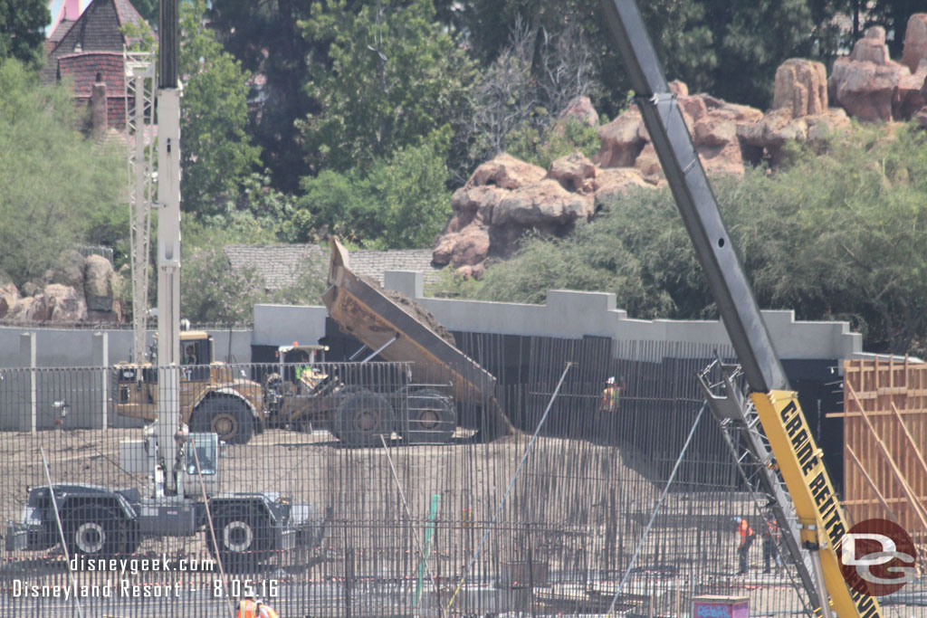 Here you can see them bringing in more dirt behind the wall along the Big Thunder Trail.