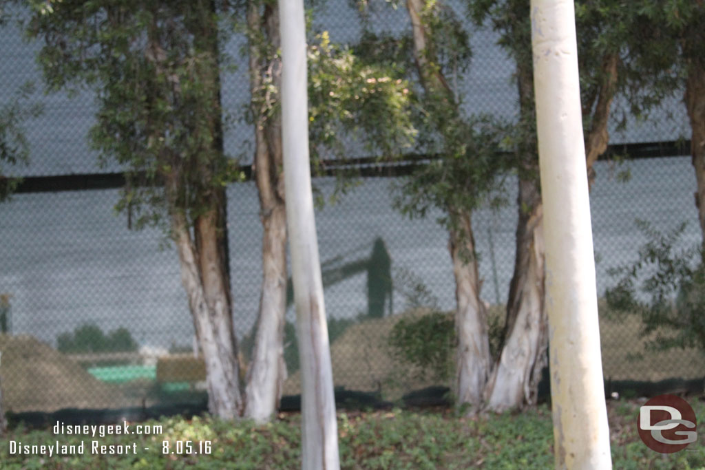 You really cannot see much from ground level here with the trees, fence, and mounds of dirt.