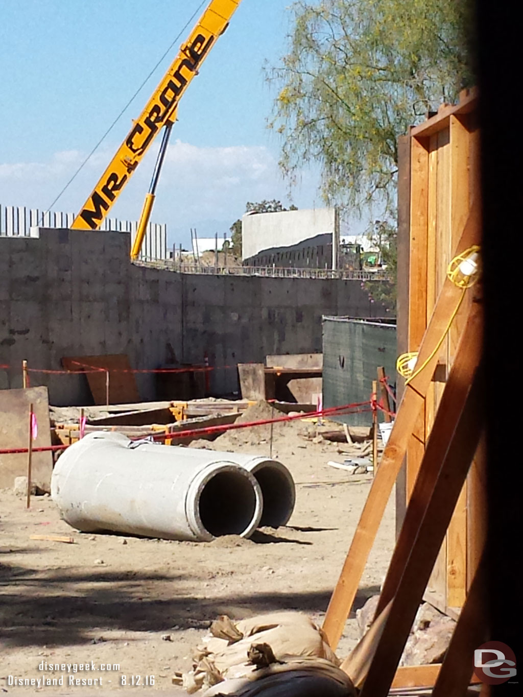 A look through the fence.  Utility work is going on here too as new pipes are being laid under the Big Thunder Trail.