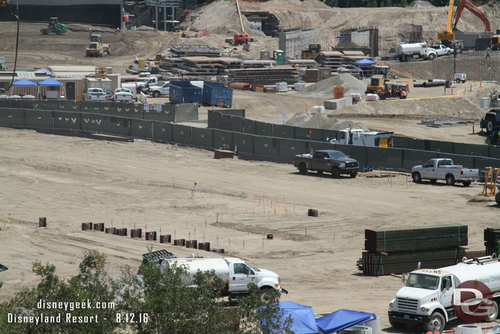 In the center they have driven more steel beams into the ground.  Assuming this is the start of the show building that will occupy this area.