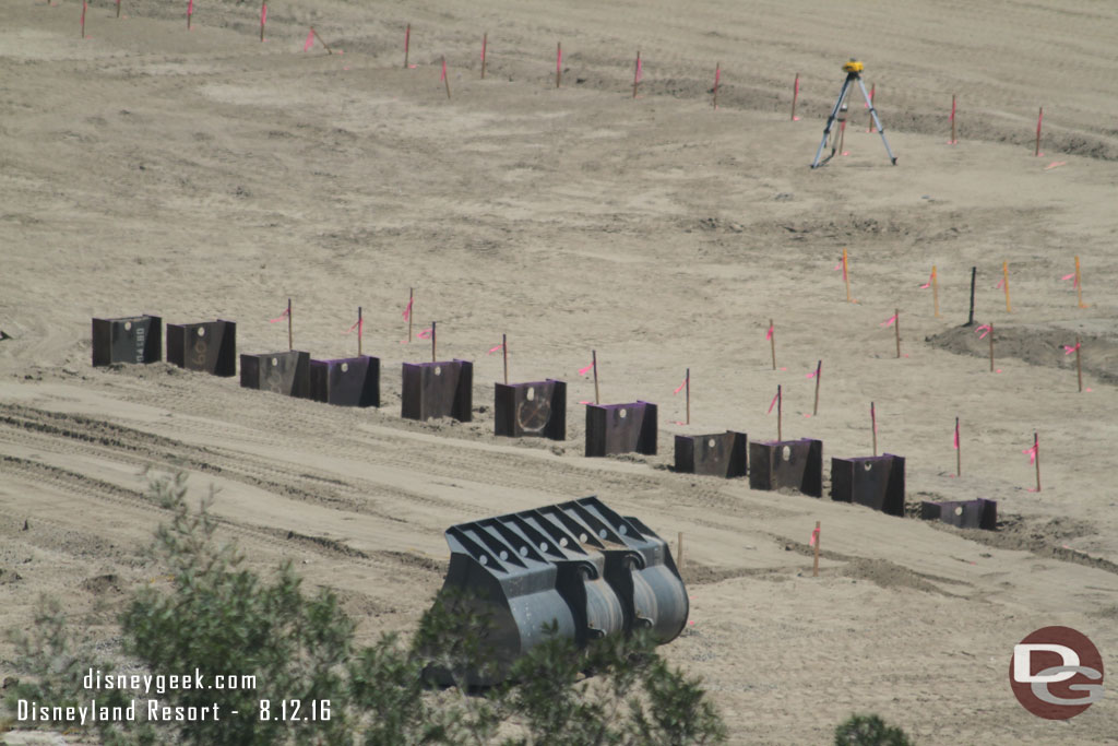 A closer look at the steel beams that are in the ground in the area nearest the structure.