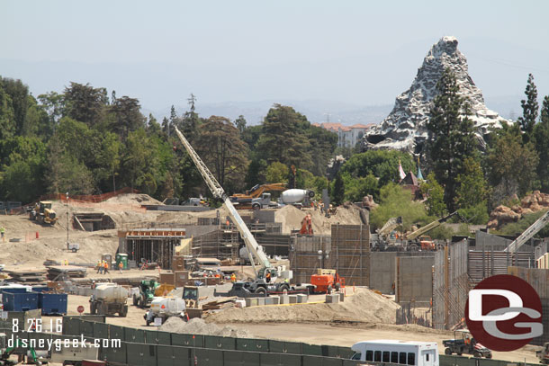 In the distance notice trucks working on the old Skyway hill.  In the center of the site it looks like a maze of walls right now as the retaining walls, Fantasmic marina, and river all continue to take shape.