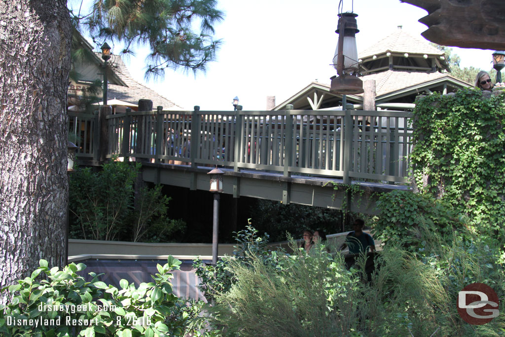 You now enter using a temporary walkway the is over the small stream area.  You enter to the right of the Winnie the Pooh entrance.