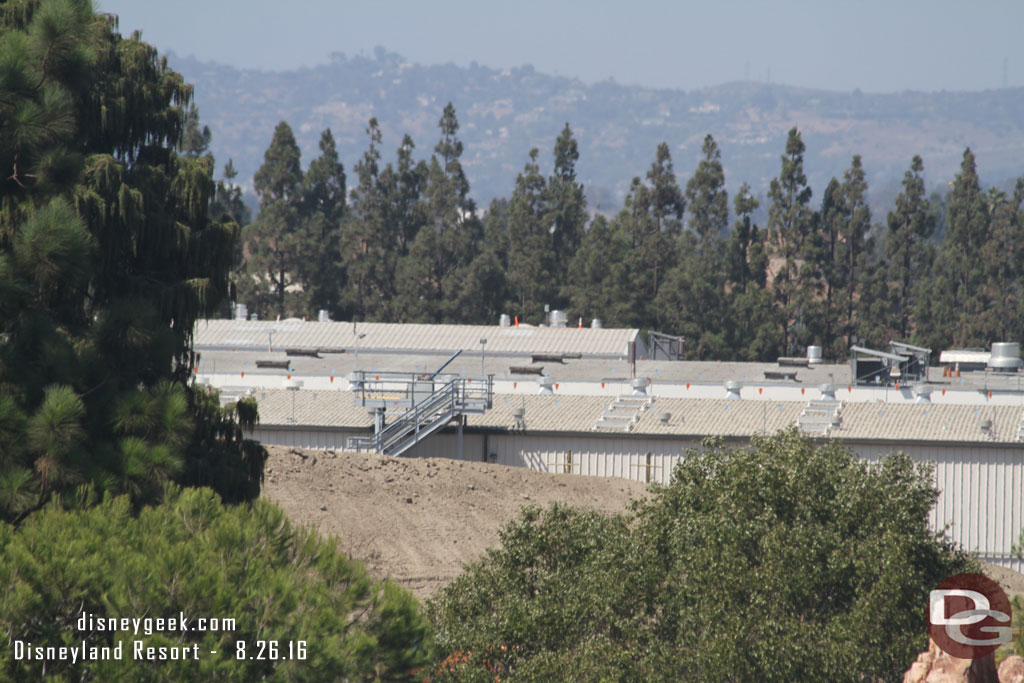 The mound of dirt is lower than the buildings again (the steps in the center are a launch point for fireworks.